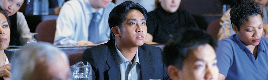 Photo of man looking toward front of class