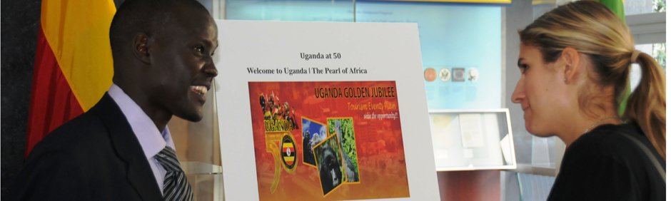 Photo of SUSI Scholars looking at a presentation board