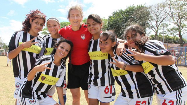 Tracy joins the girl Costa Rican soccer players.
