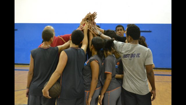 After a friendly scrimmage, the group comes together for a cheer. 