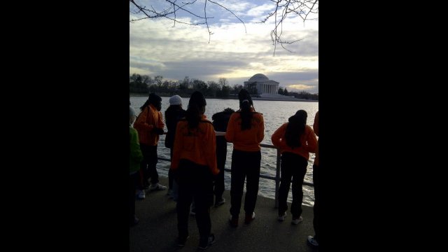 The delegation enjoys a running tour of the D.C. monuments.