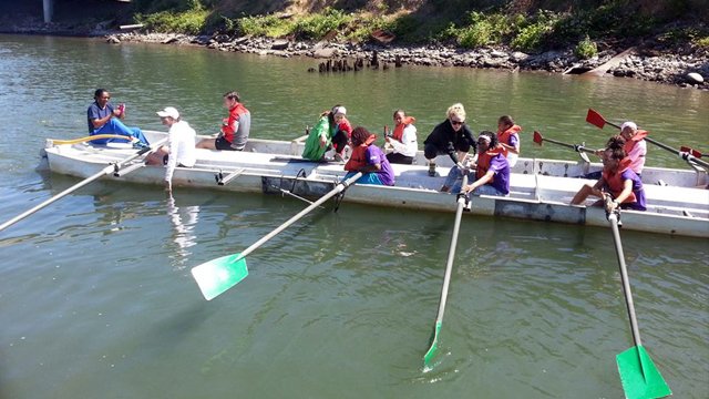 The sports visitors get in sync as they take part in an alternate sport, rowing.