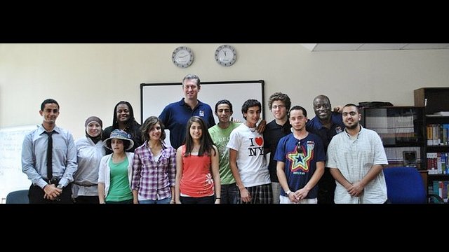 Sports Envoys pose with English Access Microscholarship participants in Jordan after a discussion on leadership and success.