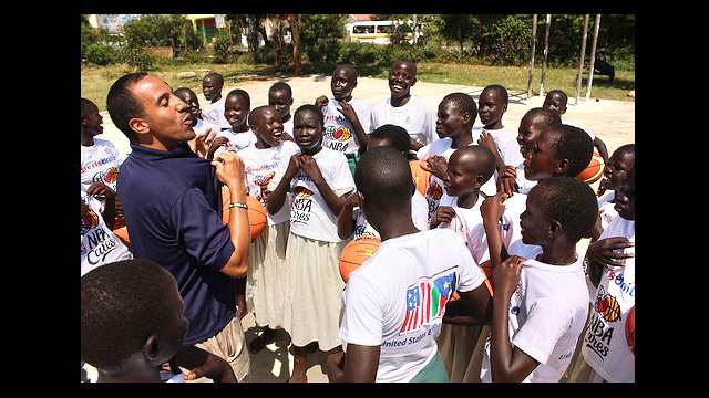 NBA Coach Patrick Engelbrecht leads the girls in a clinic.