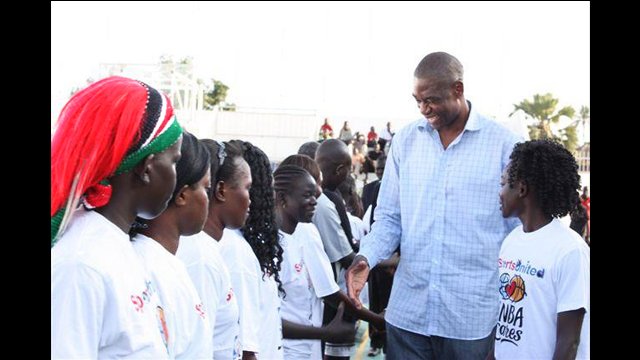 Sports Envoy Dikembe Mutombo meets with the girls basketball team.