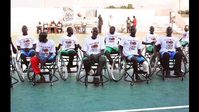 The South Sudanese wheelchair basketball team poses for a photo.