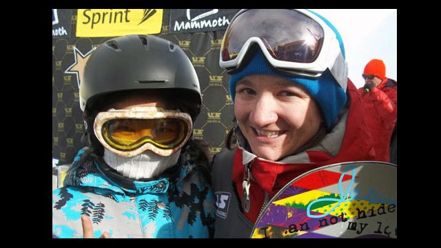Sports Visitor Nurzat celebrates with the new U.S. Snowboarding Champion, Kelly Clark, after the 2011 Snowboarding Grand Prix.