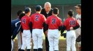 Cal Ripken gives baseball tips to young Japanese players.