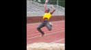 One of the young international athletes practices the long jump.