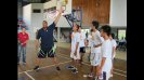 Rick Mahorn shares tips on defensive strategies with teenage boys during a basketball clinic in Indonesia.