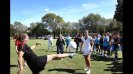 Former U.S. Women's National Team star Amanda Cromwell demonstrates a kick for the young players in Argentina.