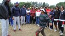 A young Indian woman demonstrates her dancing skills to peers and the envoys.