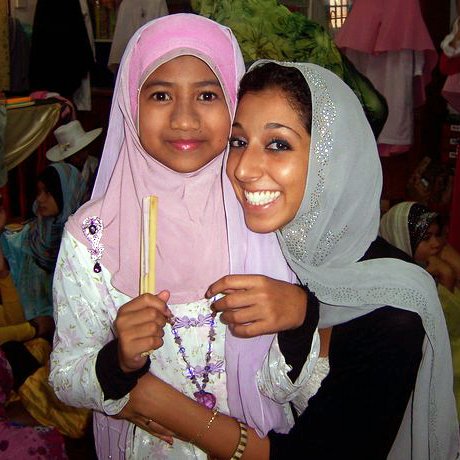 Lynn ElHarake, Fulbright English Teaching Assistants (ETA) to Malaysia, February 2011, with a student at The Muslim Girls' Fashion Club charity show in Terengganu.