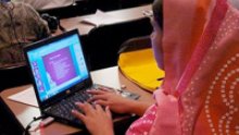 Image of a woman using a laptop.