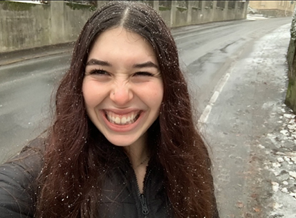 Selfie of Chloe standing on a road