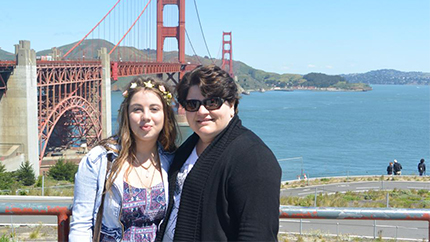 Aleksandra poses with her local coordinator in front of the Golden Gate Bridge