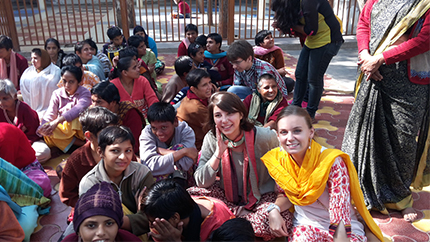Carolyn (in yellow) poses with some new friends she made in India