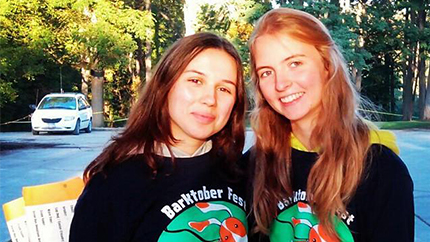 Ema (left) volunteering at the Humane Society’s annual fundraising event, Barktoberfest.