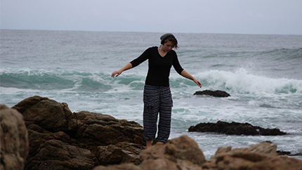 Erica walking near the surf in South Africa.