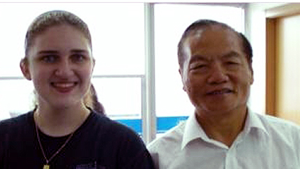 Image of Evangelista and her host father.