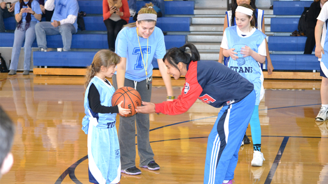 The players take part in a games and skills practice with Special Olympic athletes.