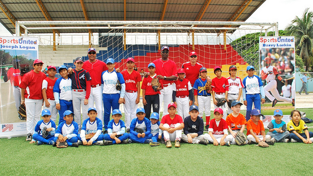 Group shot before a baseball clinic with Sports Envoys Barry Larkin and Joe Logan in Ecuador.