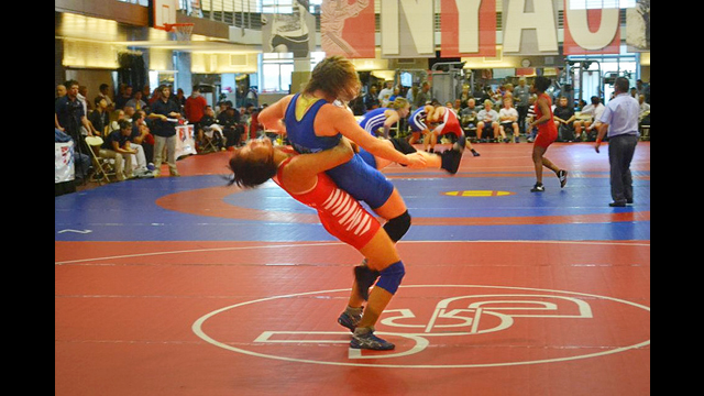 A member of the Mongolian wrestling team scores during the New York Athletic Club Holiday International Event.