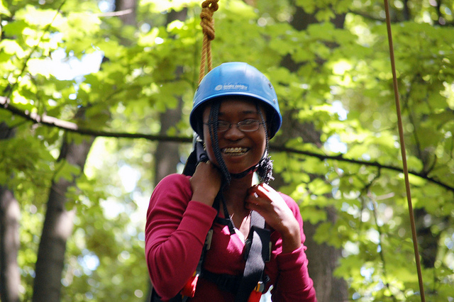 Anita smiles proudly when completing a challenging high ropes course during her exchange.