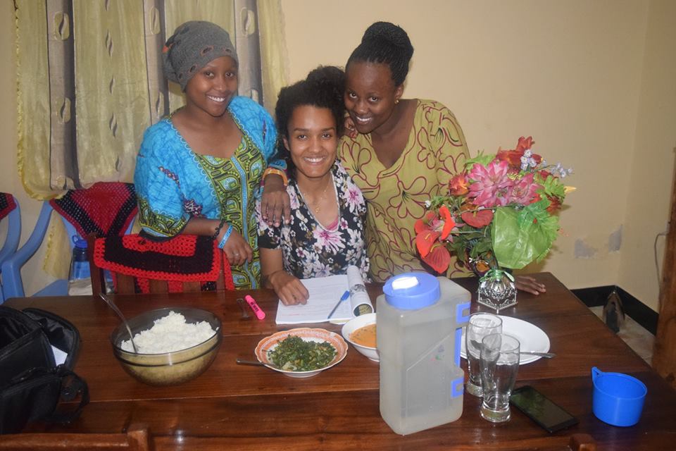 Sabrina Hassan eating meal with host family