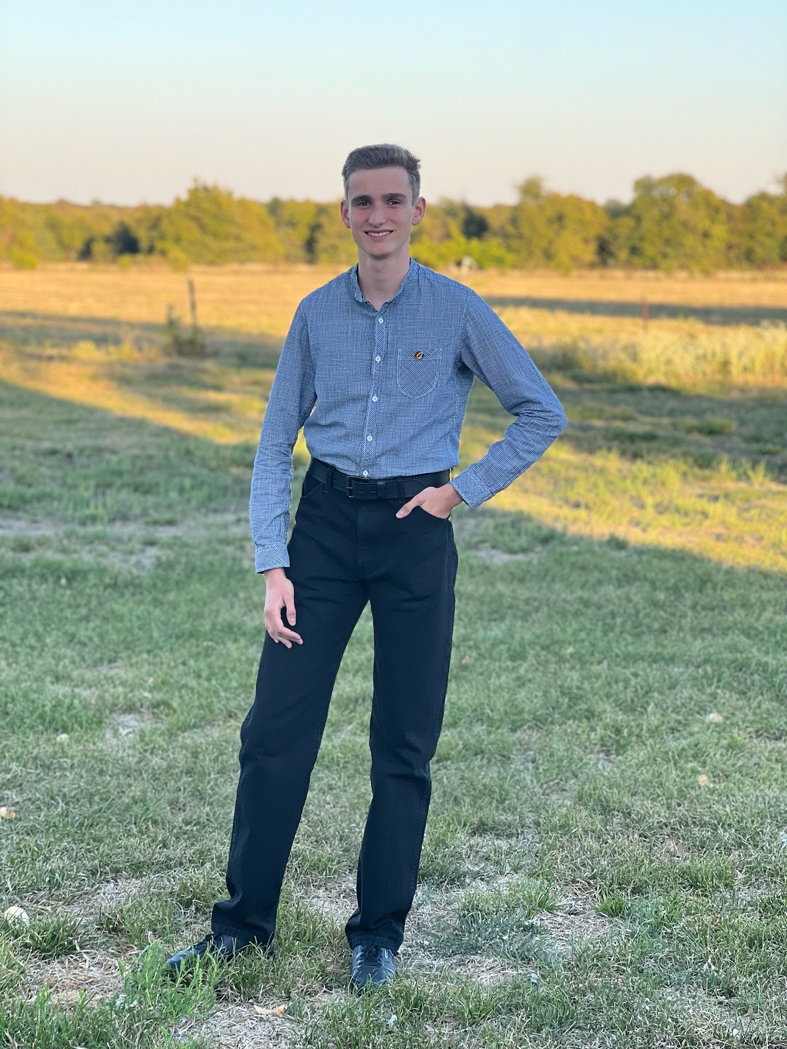 TJ stands in a field in Texas