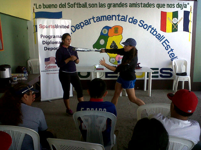 Jessica Mendoza and Ruby Rojas lead a batting clinic for coaches.