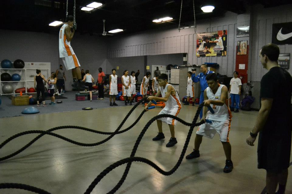 Participants work with expert basketball skills coach Stan Brudish on dribbling techniques.