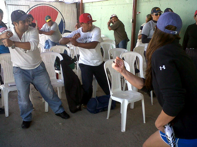 Softball coaches in Nicaragua practice batting stances and learn new coaching techniques from Jess Mendoza.