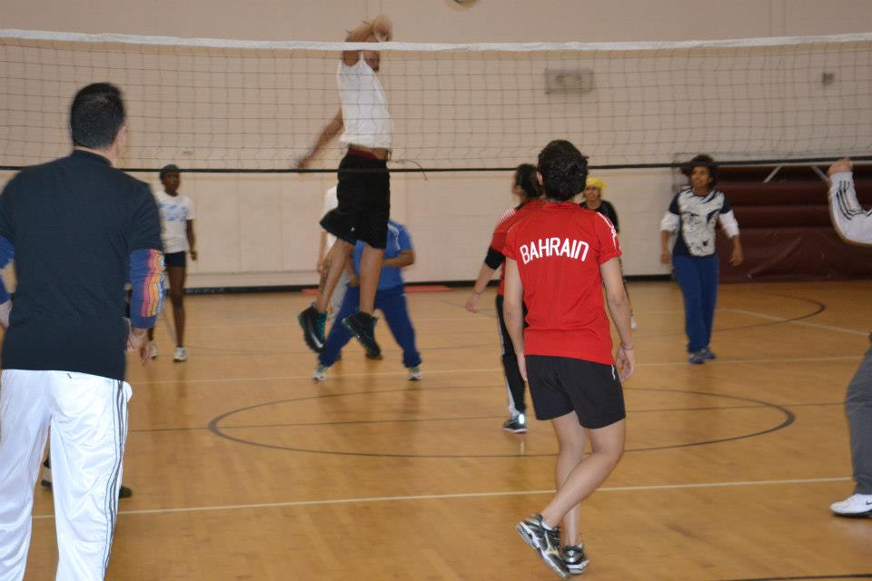 The female volleyball coaches take part in a friendly game with Americans. 