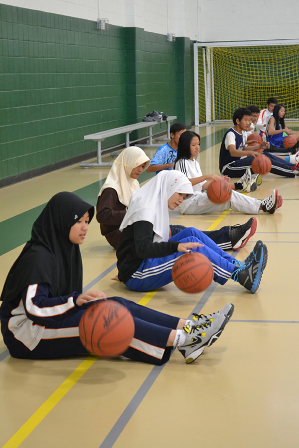 The group warms up for practice.