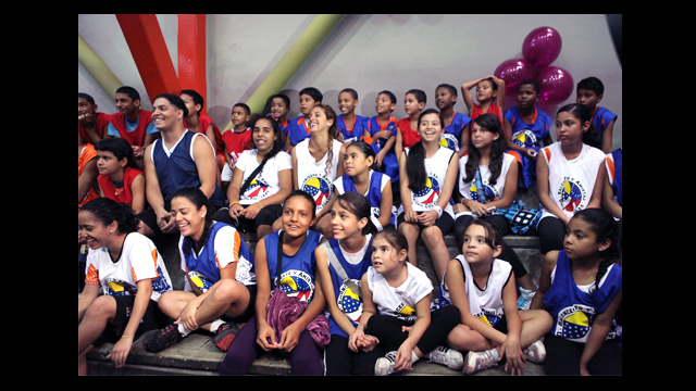 Clinic participants watch the activities in the gymnasium in Chacao, Venezuela.