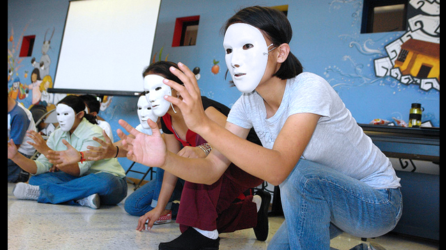 Theater workshop participants in San Salvador explore their creativity.