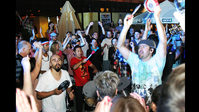 Ozomatli band members join the crowd at Herbert Hoover Square in Warsaw, Poland.