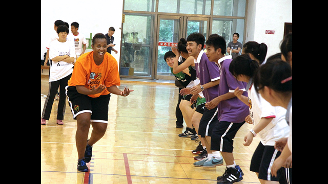 Tamika Raymond runs defense drills with the students from Benxi No. 1 High School in China.