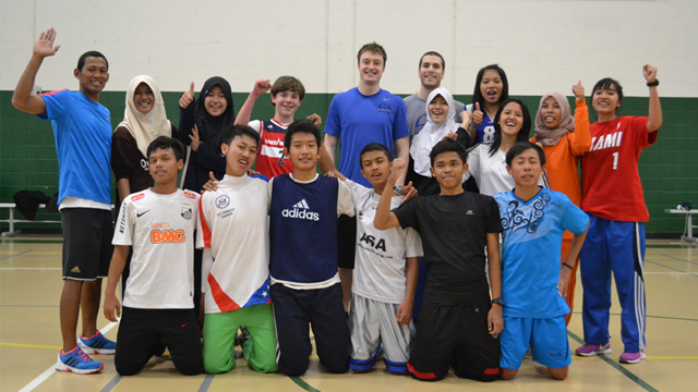 The group poses for a photo at George Mason University.