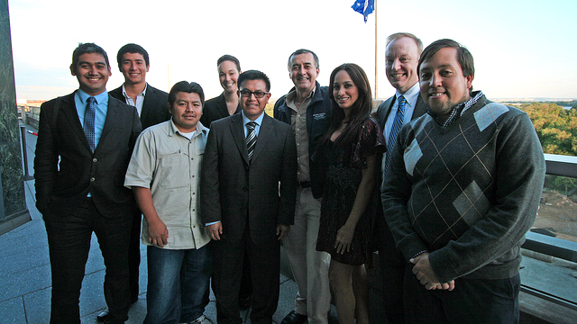 Fellows enjoy the view from the balcony of the Ben Franklin Room balcony at the U.S. Department of State.