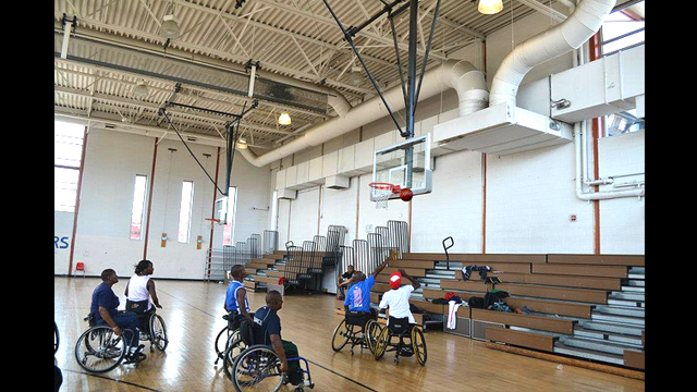 South African basketball players play wheelchair basketball with Mobility International USA.