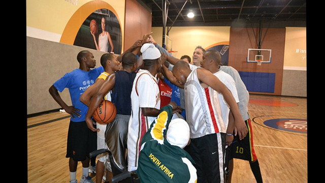 Coaches huddle after an intensive basketball clinic in Washington, D.C.