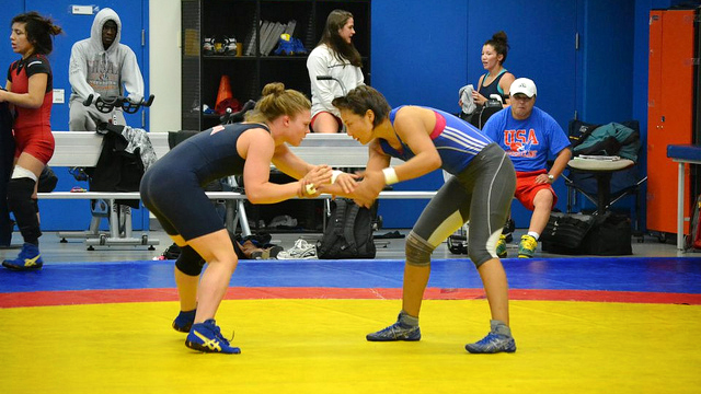 U.S. and Mongolian freestyle wrestlers begin their match.