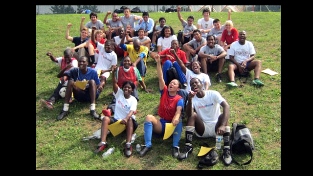 Swaziland coaches and members of the Hylton High School Boys Varsity Soccer Team celebrate with a group photo after a tough workout.