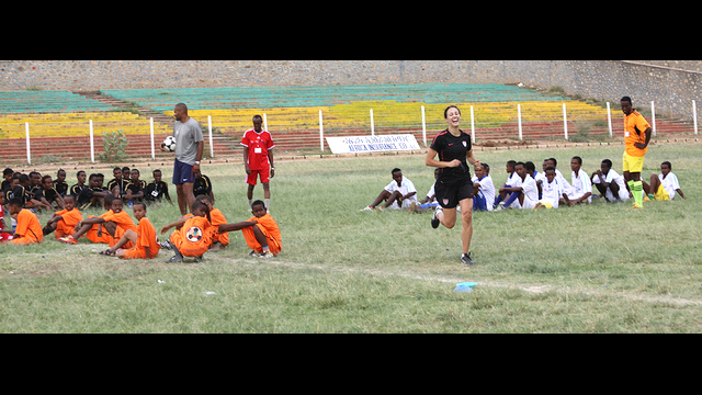 Kate Markgraf works with young male soccer players during a challenging workout.