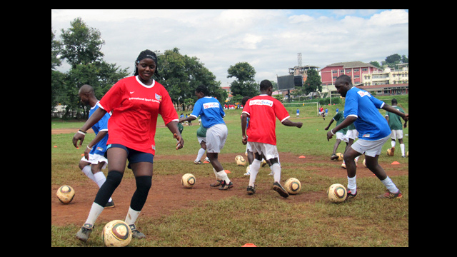 Ugandan soccer coaches practice their dribbling skills at a clinic in Kampala.