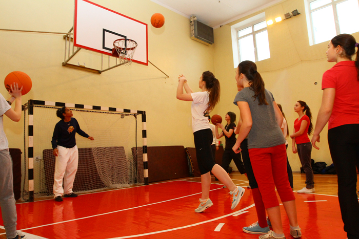 A young Ukrainian female launches a shot during practice.