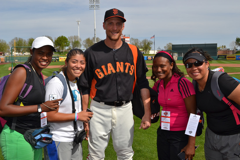 Hunter Pence of the San Francisco Giants and female coaches from the Dominican Republic and Venezuelan.