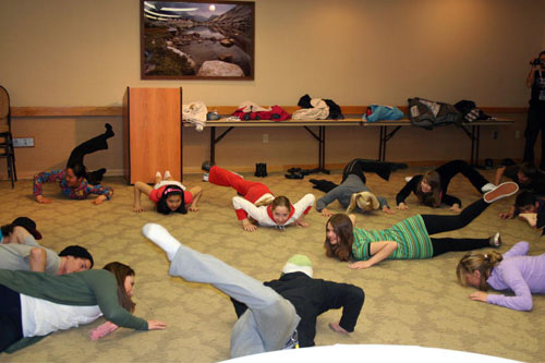 The group stretches with national team members including Matt Ladley, winner of the Grand Prix, and Spencer Tamblyn, US National Team coach.